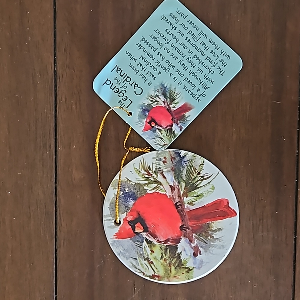 Red cardinal ceramic Christmas ornament with legend of the cardinal card